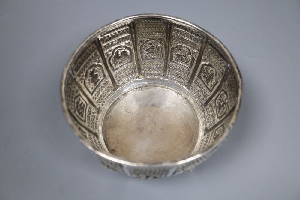 An early 19th century Burmese white metal, embossed with figures, fish, animals and crustaceans, diameter 12.3cm, 7oz.